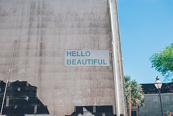 Hello Beautiful Sign on Weathered Concrete Wall