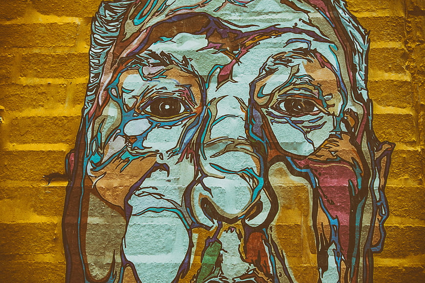 Colorful Hitchcock Street Art Mural on Brick Wall
