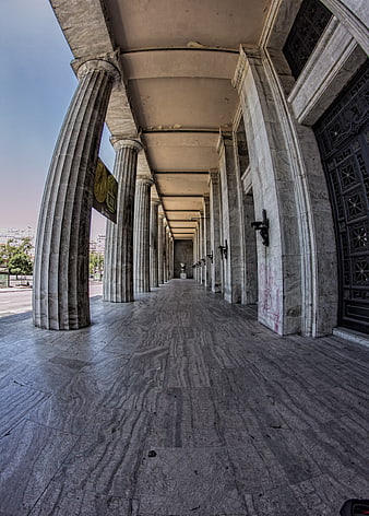 Perspective view of marble columns in a grand architectural colonnade