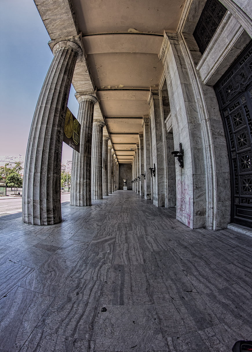 Perspective view of marble columns in a grand architectural colonnade