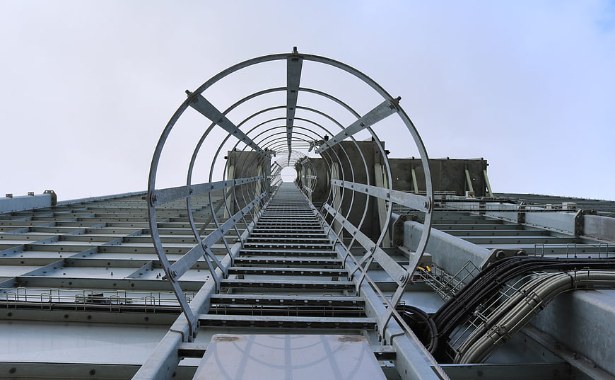Industrial steel walkway with metal arches on rooftop