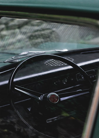 Vintage Car Interior with Classic Steering Wheel and Dashboard