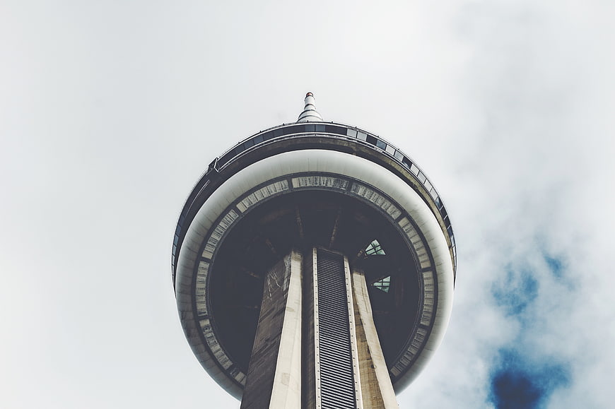 Low angle view of observation tower against cloudy sky