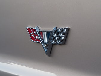 Close-up of Chevrolet V8 emblem on classic car