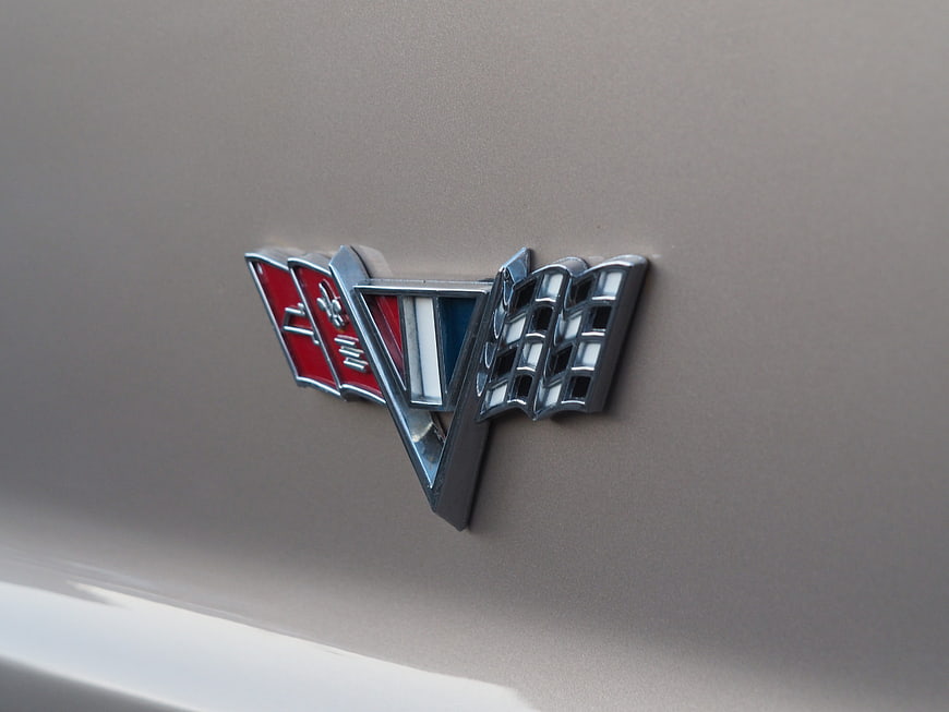 Close-up of Chevrolet V8 emblem on classic car