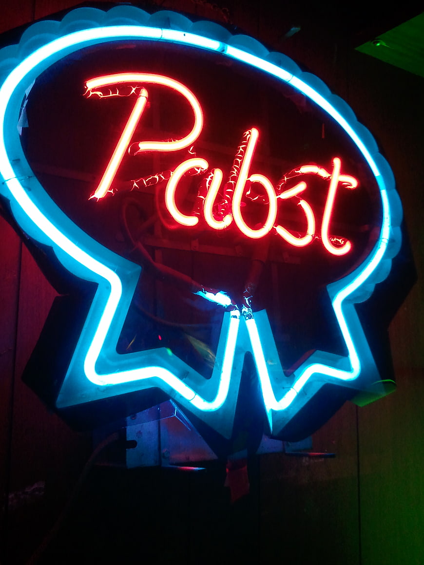 Vintage Pabst Blue Ribbon Neon Sign in Dark Bar Setting