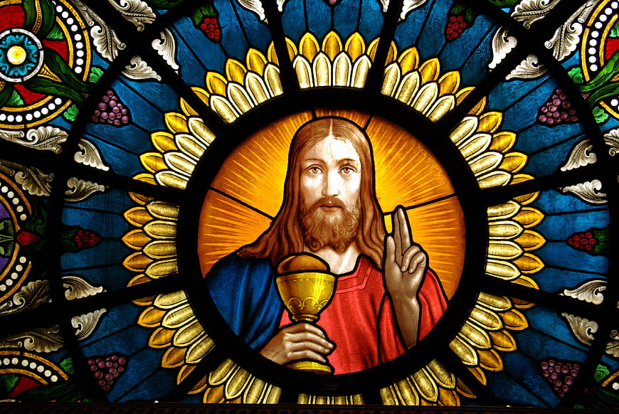 Stained Glass Window Depicting Jesus Christ Holding Chalice