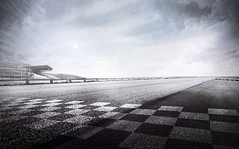 Black and white checkered finish line on a race track