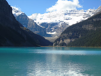Turquoise Lake Louise Surrounded by Snowy Mountains