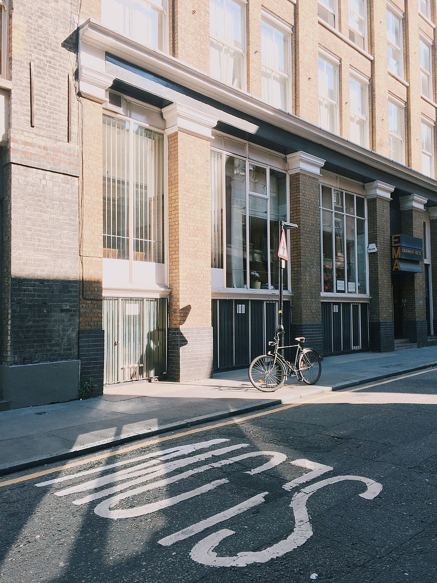 Vintage street scene with bicycle and bus stop road marking