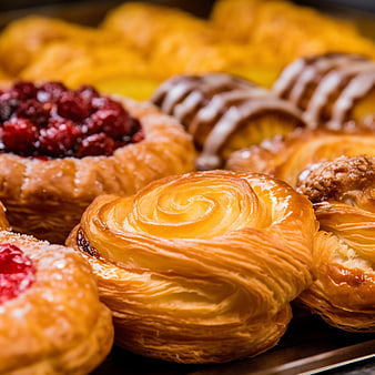 Close-up of assorted golden pastries and sweet desserts