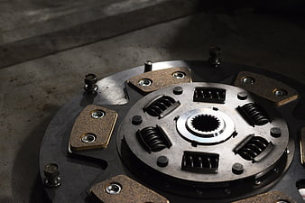 Close-up of automotive clutch disc with friction pads and springs