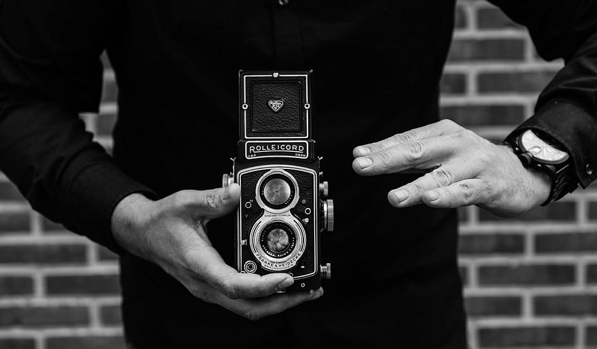 Man Holding Vintage Rolleicord TLR Camera