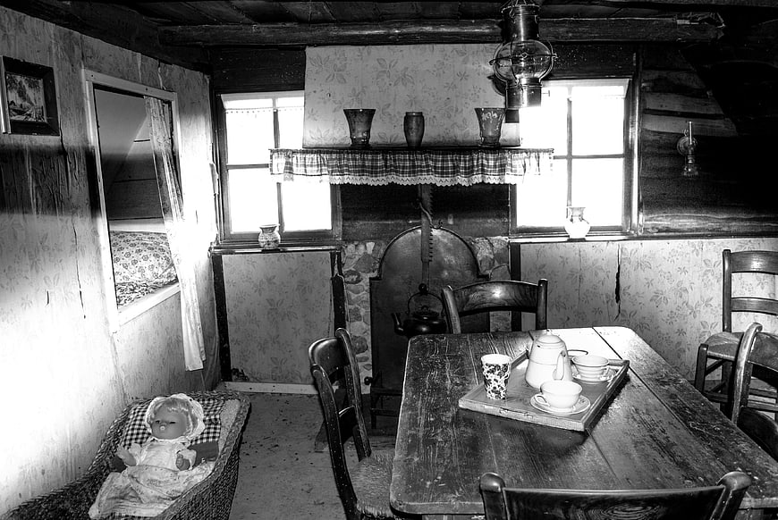 Vintage black and white interior of a rustic Dutch farmhouse kitchen