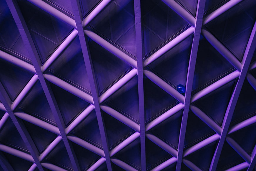 Abstract Geometric Architecture with Purple Neon Lighting