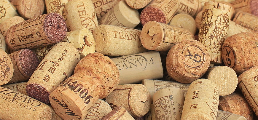 Close-up of assorted wine corks with printed labels