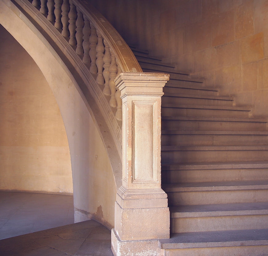 Classic Stone Spiral Staircase with Arched Railing
