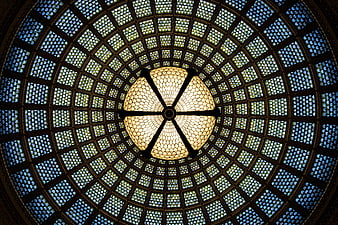 Ornate stained glass dome ceiling with central chandelier