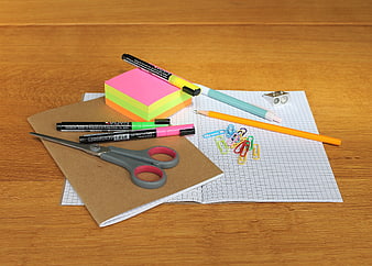 Colorful School Supplies Flat Lay on Wooden Desk