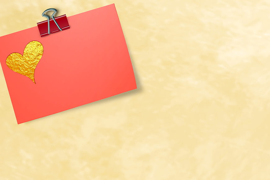 Red Card With Gold Heart And Clip On Textured Yellow Background