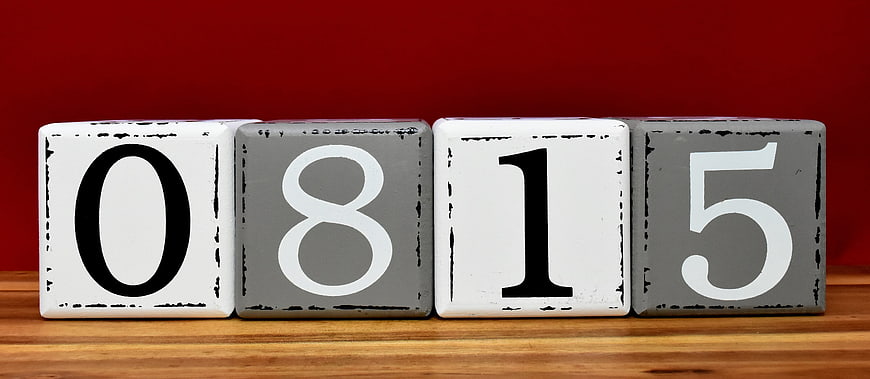 Wooden Blocks Displaying Number 0815 Against Red Background
