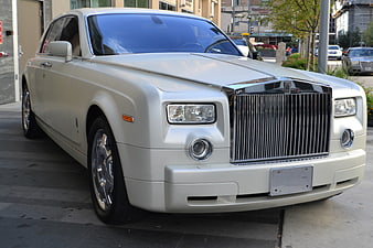 White Rolls-Royce Phantom parked on city street