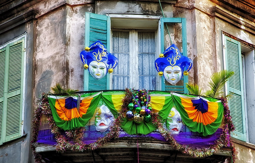 Mardi Gras Masks And Banners On French Quarter Balcony
