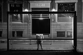 Woman Waiting Alone at Night Bus Stop