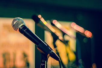 Close-up of Microphone on Stage with Blurred Background