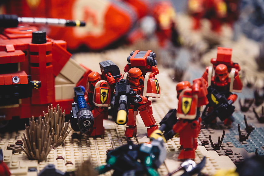 Close-up of red Lego Space Marines in desert battle scene