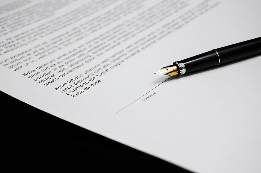 Fountain pen on contract document ready for signature
