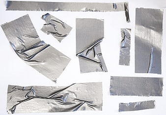 Silver duct tape pieces on white background