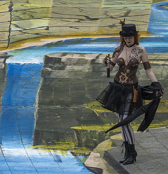 Steampunk woman posing on colorful 3D street art pavement