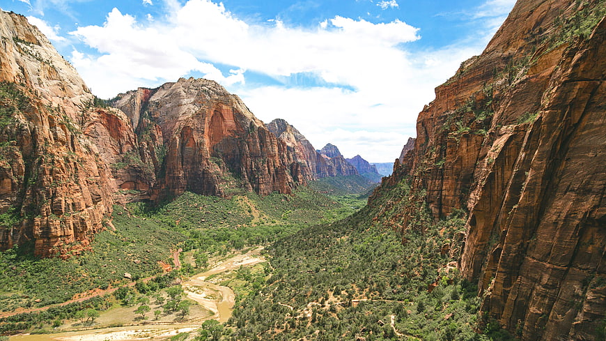 Majestic Red Rock Canyon Landscape with Green Valley and River
