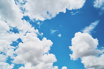 Fluffy White Clouds in a Bright Blue Sky