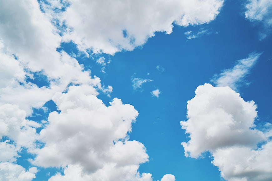 Fluffy White Clouds in a Bright Blue Sky