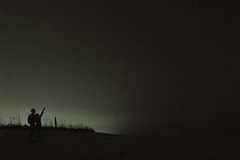Silhouette of Couple Stargazing Under Night Sky