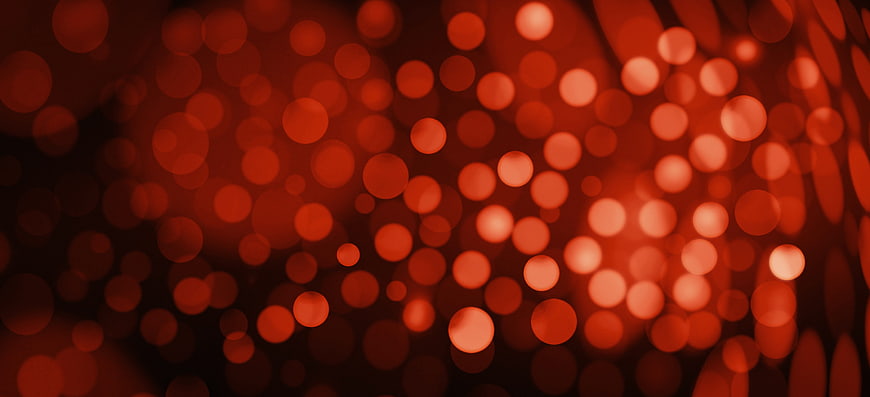 Abstract Red Bokeh Background With Blurred Light Circles