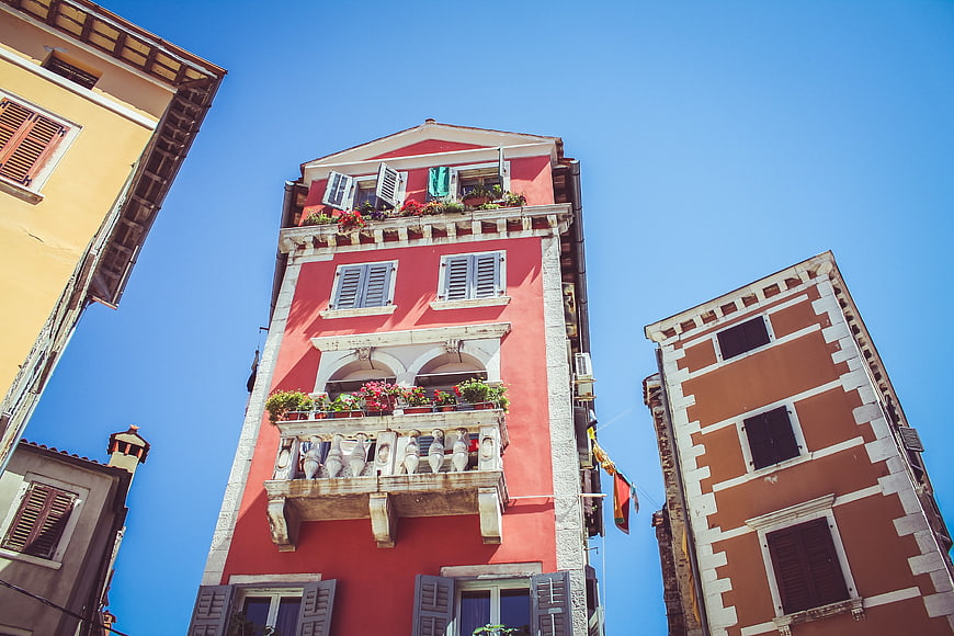 Colorful Venetian Buildings with Balconies and Blue Sky