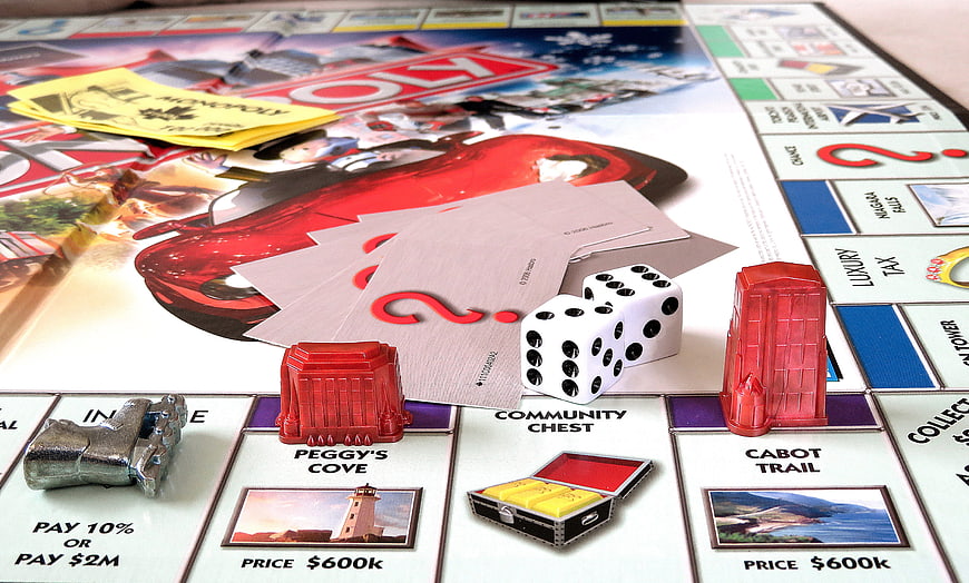 Close-up of Canadian Monopoly Board Game with Dice and Tokens