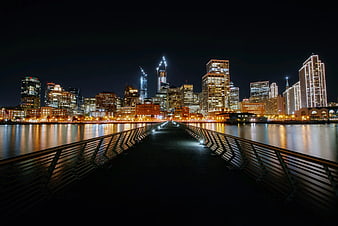 Night Cityscape with Bridge Leading to Downtown Skyline