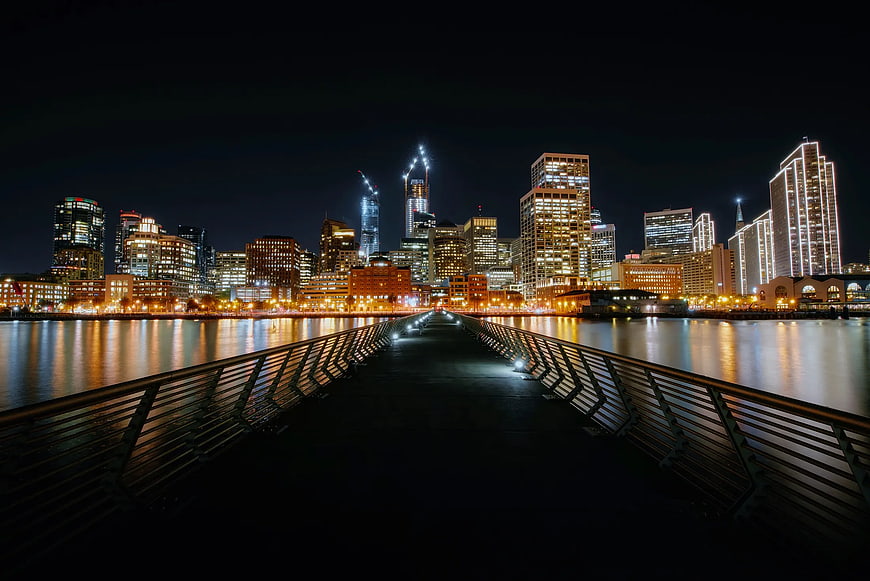Night Cityscape with Bridge Leading to Downtown Skyline