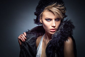 Studio Portrait of Woman in Black Fur Coat and Hat