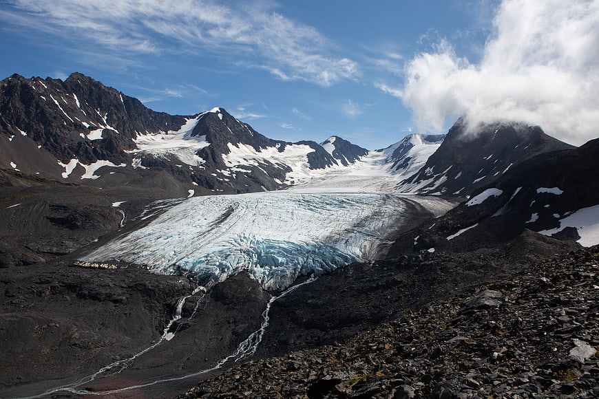 Majestic Glacier Flowing Through Rocky Mountain Valley