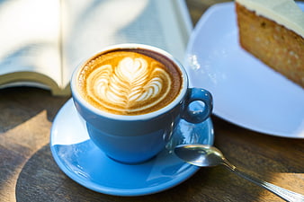 Blue Coffee Cup with Latte Art and Cake