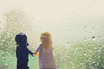 Lego Star Wars figures holding hands in the rain
