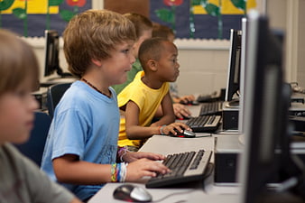 Young students using computers in a classroom