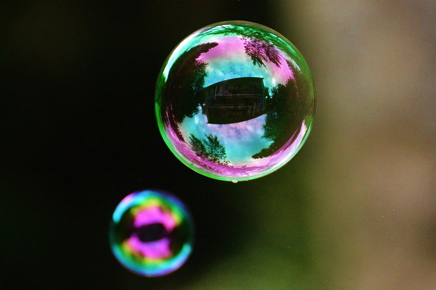 Colorful Soap Bubbles Reflecting Nature and Sky
