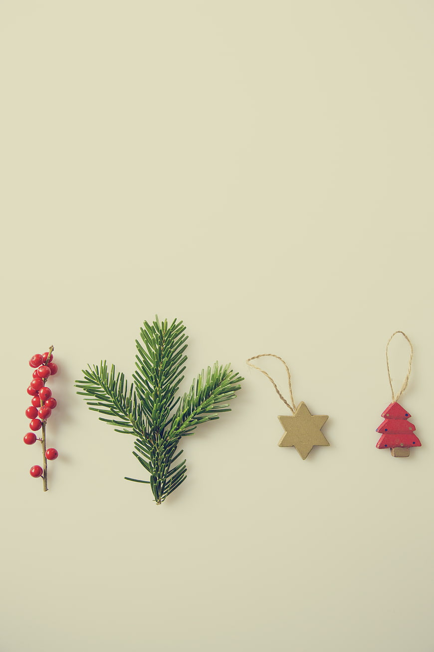 Minimalist Christmas Flat Lay with Pine Branch and Ornaments