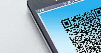 Smartphone displaying QR code on screen